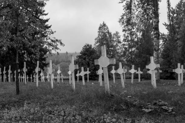 Nameless graves with rows of white wooden cross