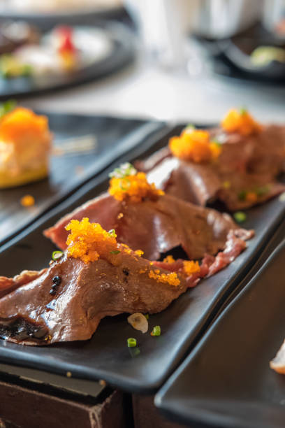 Set of grilled Wagyu beef sushi with Flying fish roe or Tobiko on plate