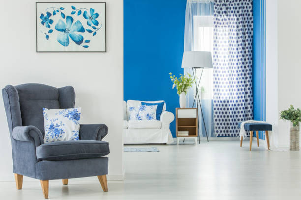 istock White cushion on blue armchair 933615484