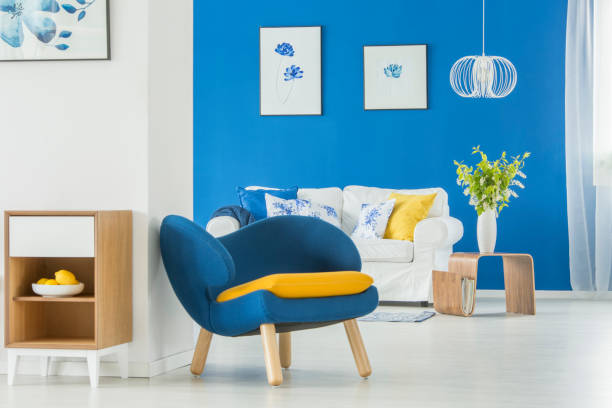 istock Yellow accents in blue room 933615496