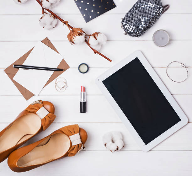 istock Flat lay with cotton branch, shoes and tablet 933616122