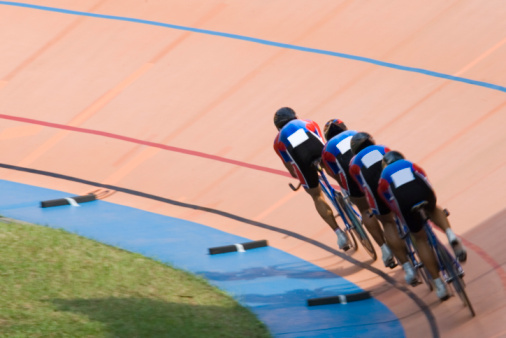 Individual cycling time trials at a velodrome.