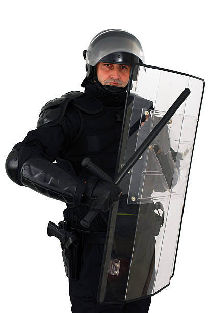 Riot police officer with Barton and Perspex shield policeman with full anti riot equipment perspex stock pictures, royalty-free photos & images