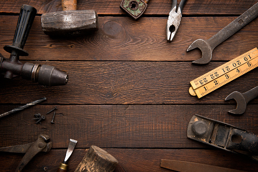 Old Work Tools on Rustic Background with copy space