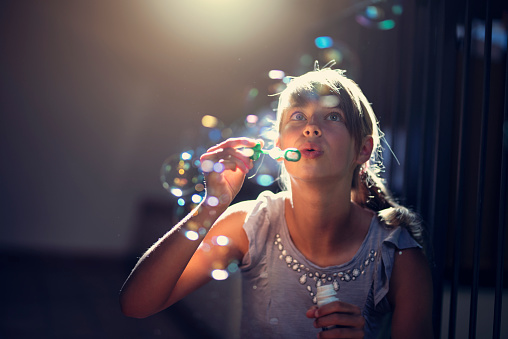 Teenage girl playing with bubbles
Nikon D810