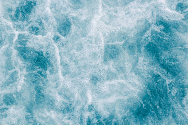 istock Abstract blue sea, ocean water with white foam and bubbles for background, nature background concept 933641148