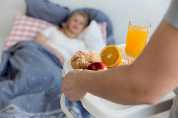istock Couple enjoying breakfast in bed 933652666