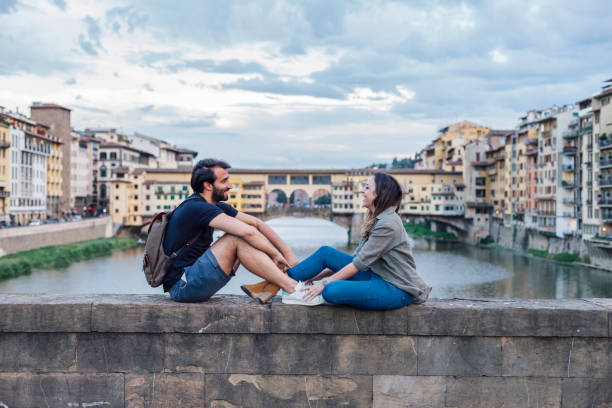 istock Couple at sunset in front of Ponte Vecchio, Florence 933653660