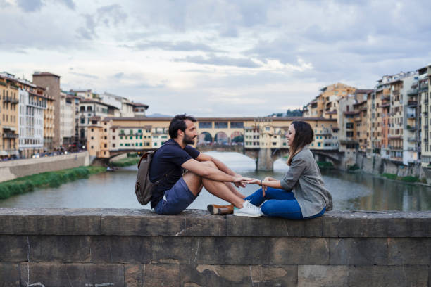 istock Couple at sunset in front of Ponte Vecchio, Florence 933653666