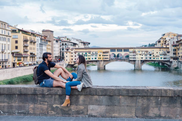 istock Couple at sunset in front of Ponte Vecchio, Florence 933653678