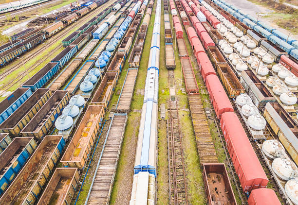 istock Railway wagons seen from the bird's eye view. A convergent perspective created by colorful railway wagons. 933653968