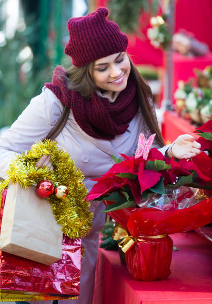 istock Girl at Christmas market 933657478