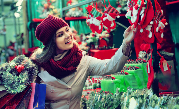 istock Young girl near counter with mistletoe 933657490