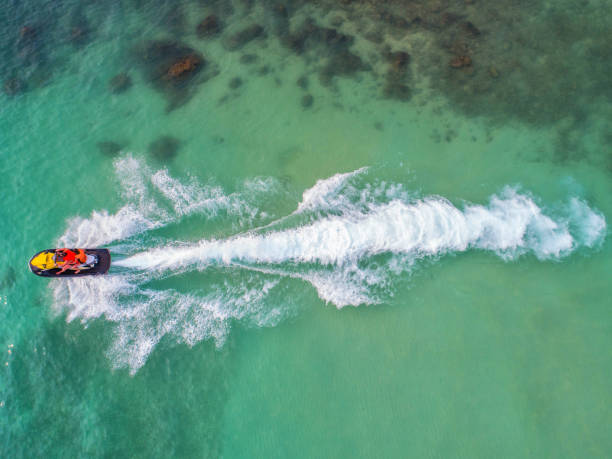 istock People are playing jet ski at sea during the holidays. 933664098