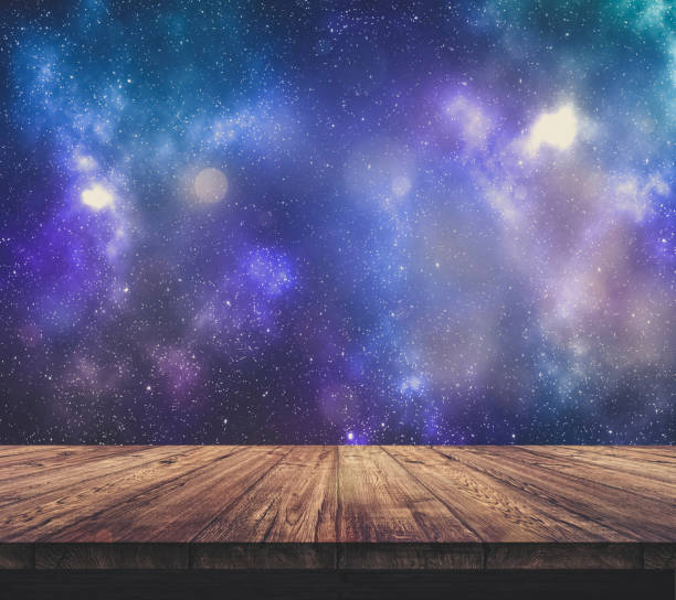 istock Wood table top with blurred light colourful bokeh abstract background 933666960