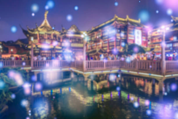 Abstract blurred people socializing during shanghai yuyuan garden at night
