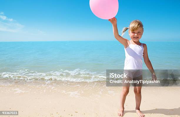 Child On Coast Of Sea Stock Photo - Download Image Now - Balloon, Beach, Beauty