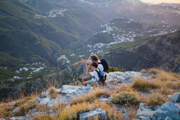 istock Father and Son on mountain Peak 933671244