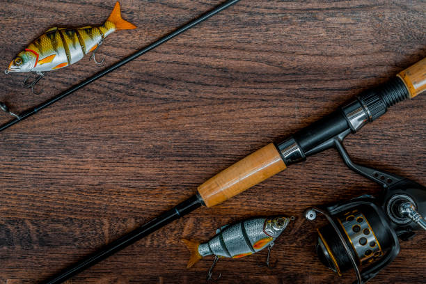 istock Fishing tackle still life on a wooden background. 933671672