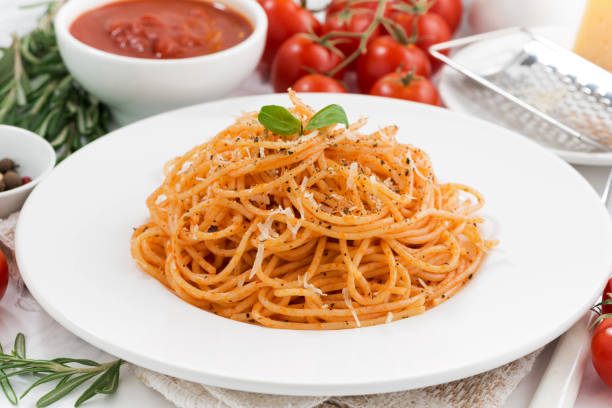 istock pasta with tomato sauce and ingredients, closeup 933673698