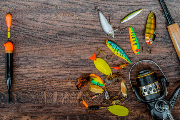 istock Fishing tackle still life on a wooden background. 933675840
