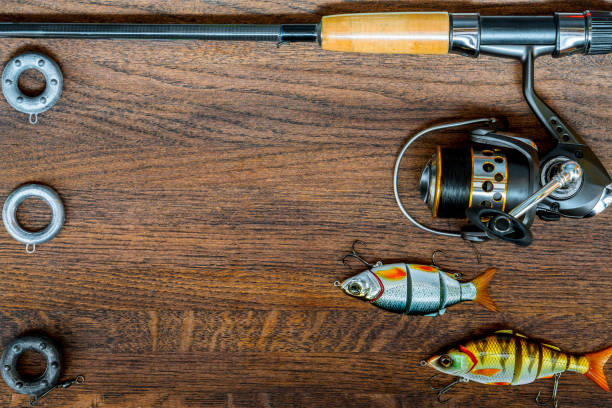 istock Fishing tackle still life on a wooden background. 933680088
