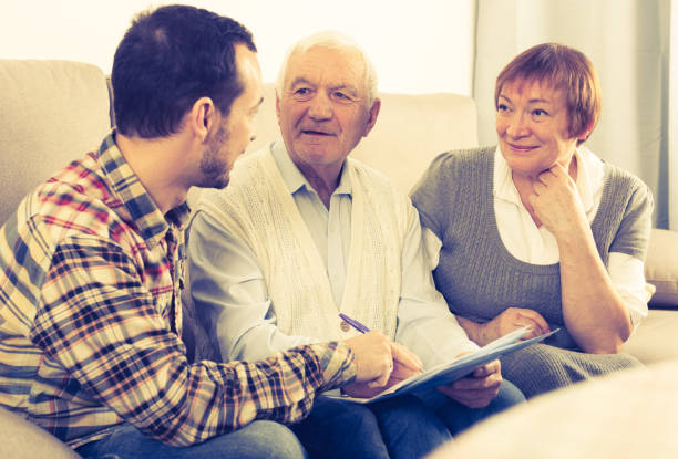 istock Elderly couple and insurance agent 933681652