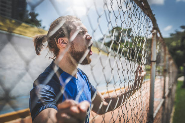 istock French fan watching a soccer game 933695060