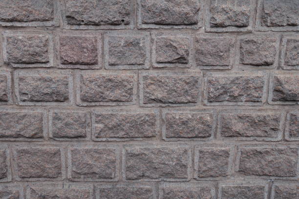 istock Roughened faces of granite blocks (rustication technique) 933700950