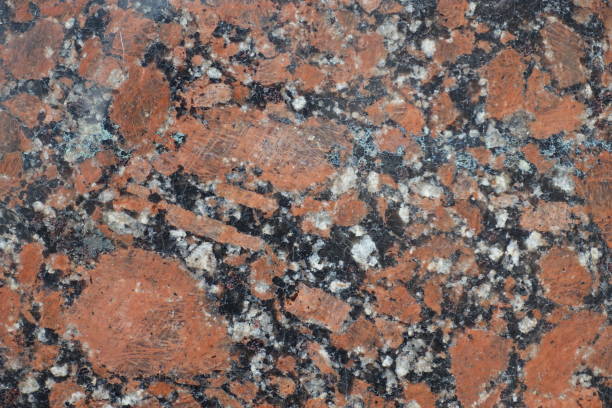istock Grainy pattern of polished pink granite stone 933700968