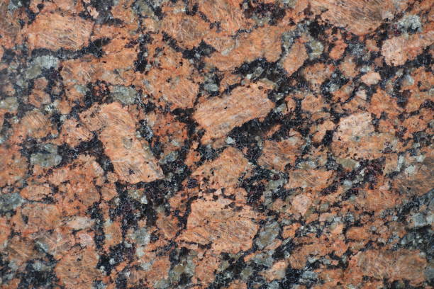 istock Black, pink and gray polished granite stone 933700978