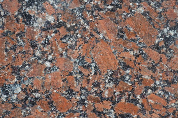 istock Granular pattern of polished pink granite stone 933701062