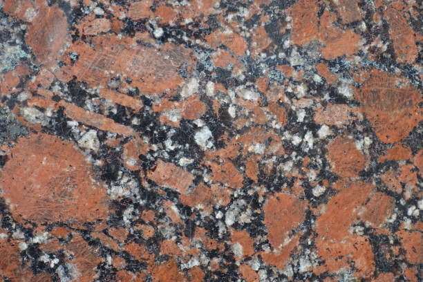istock Coarse grained structure of pink granite stone 933701072