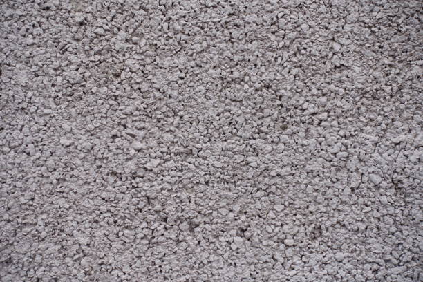 istock Grainy texture of painted pinkish gray wall 933701166