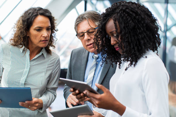 istock Business people in office ....talking about their problems...cute black woman using laptop 933713130