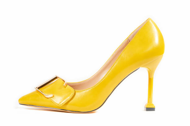 Yellow high heel shoes isolated on white background with clipping path. Women's shoes. Yellow high heel shoes isolated on white background with clipping path. Women's shoes. yellow shoes stock pictures, royalty-free photos & images