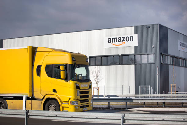 Logistics center of amazon in Raunheim-Moenchhof, Germany Facade of new logistics center of amazon in Raunheim-Moenchhof, Germany. Amazon (Amazon.com, Inc.) is an American electronic commerce and cloud computing company and the largest Internet retailer in the world as measured by revenue and market capitalization. In the foreground a passing freight truck amazon.com photos stock pictures, royalty-free photos & images