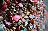 Valentine's Day - many padlocks on a bridge - red padlock with heart