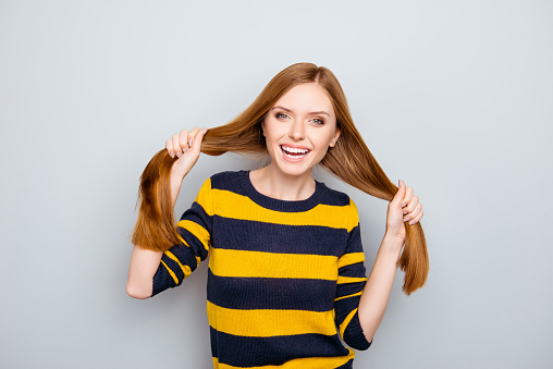 Fun stylish laughing yellow black redhead emotion expressing design stylist people funky fooling concept. Portrait of careless pretty with strong smooth straight hair girl isolated on gray background