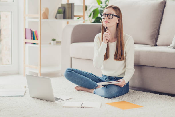 istock Crossed legs denim casual learning success creative work worker writer author comfort cozy people brain concept. Clever minded smart pensive cute with straight hairstyle teenage girl writing essay 933796262
