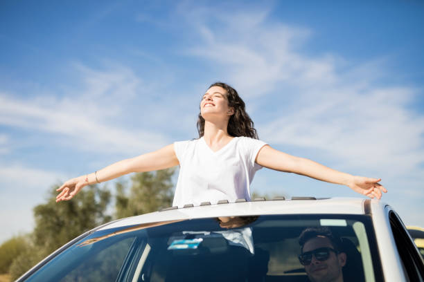 istock Woman enjoying on road trip 933796400