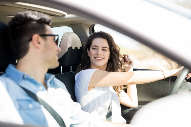 istock Beautiful couple driving a car 933800820