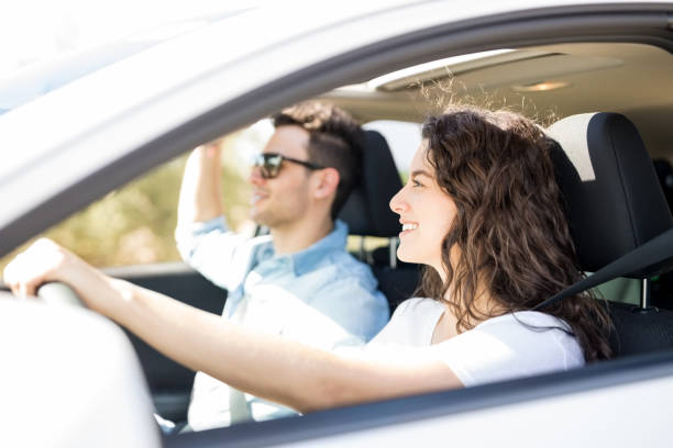 istock Girlfriend driving a car with boyfriend 933804176