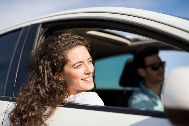 istock Beautiful woman traveling by a car 933804848