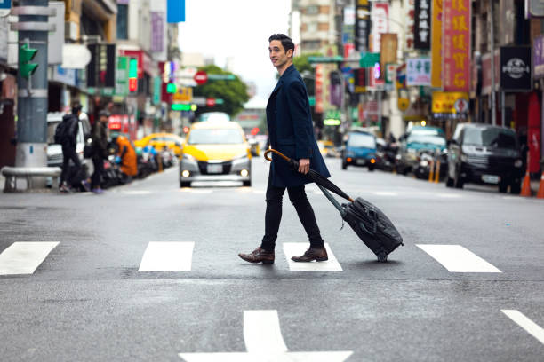 istock Happy Asian man in the city downtown 933805130