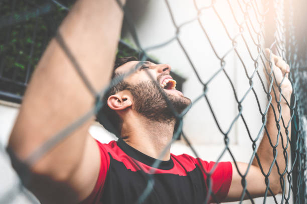 Soccer Fan Watching a Game in Stadium