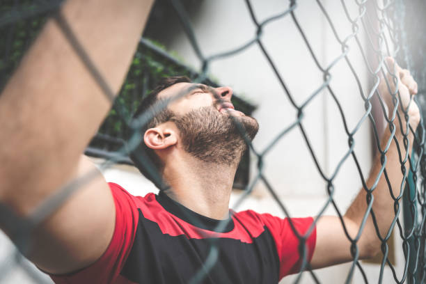 istock Soccer Fan Watching a Game in Stadium 933809378