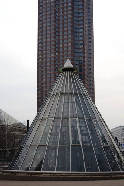 Conical lift hoods made of glass in front of the Trade fair Tower at the Friedrich-Ebert-Park in Frankfurt Main.