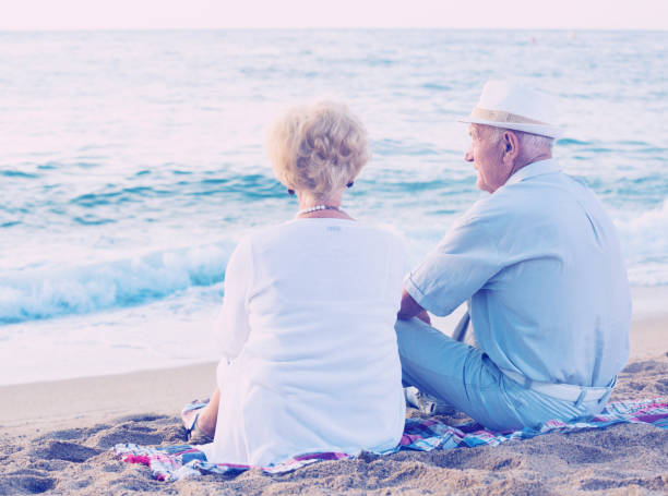 istock pensioners sitting back together at the sea 933815328