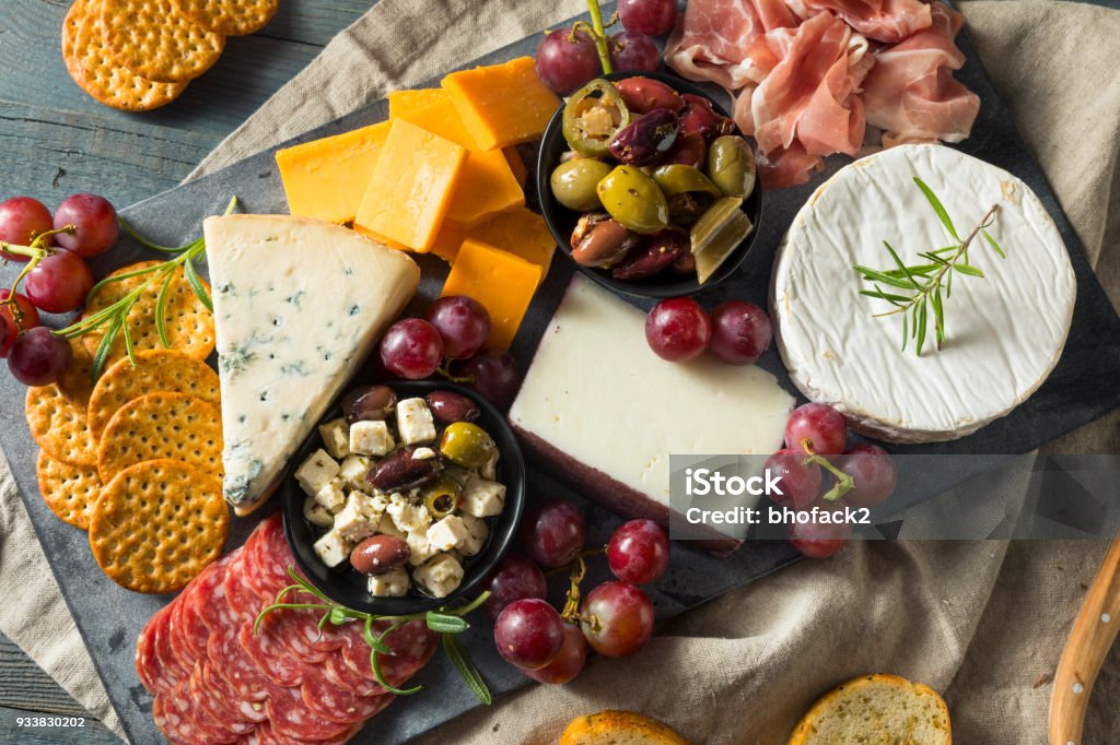 Gourmet Fancy Charcuterie Board Gourmet Fancy Charcuterie Board with Meat Cheese and Grapes Charcuterie Stock Photo